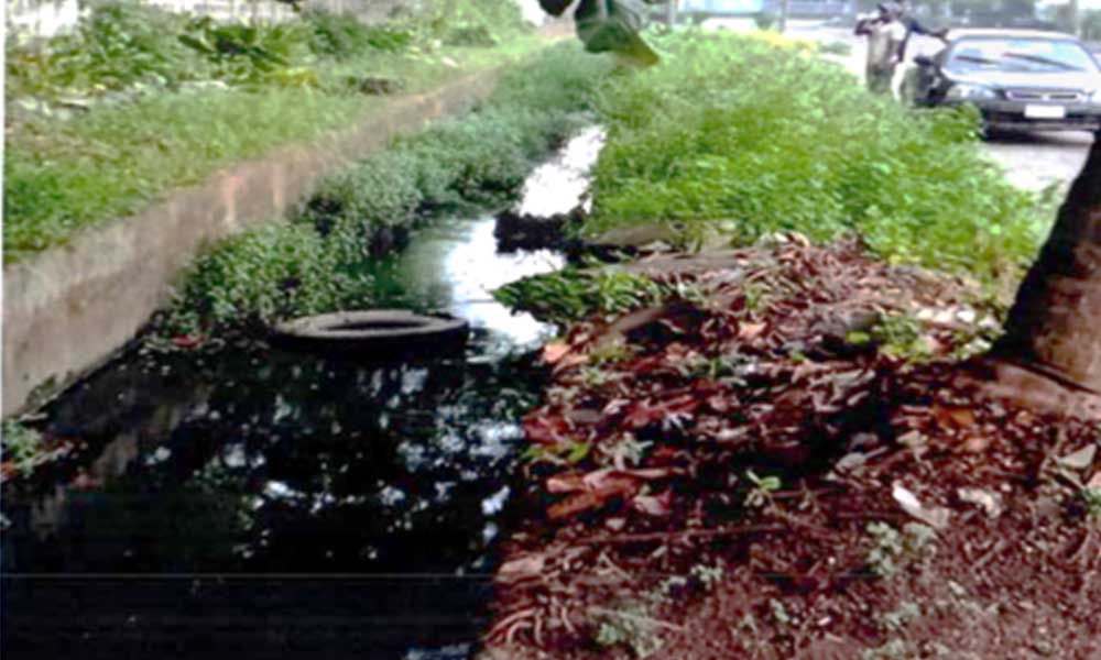Clogged drainage before cleaning and provision of cover slab at Saro Close