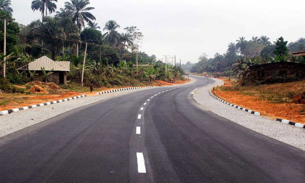 Finished Asphalted road section with surface dressed shoulders and road marking
